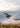 Snow covered Lindis Pass with winding road, Central Otago, New Zealand