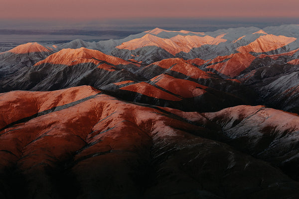 aerial photo of Waitaki ranges in winter sunrise